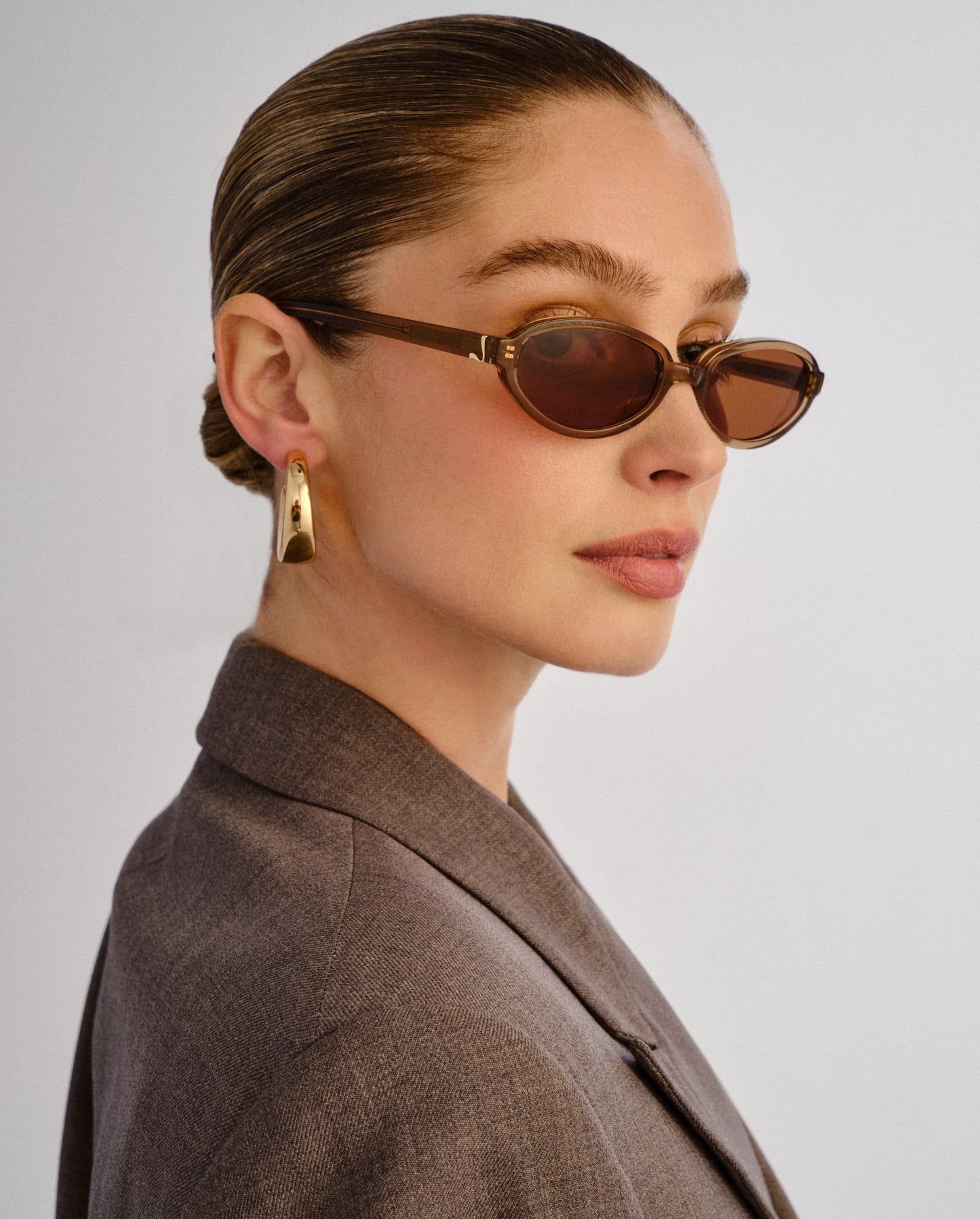 The Olive Chocolate Crystal Female Oval Sunglasses | Luv Lou