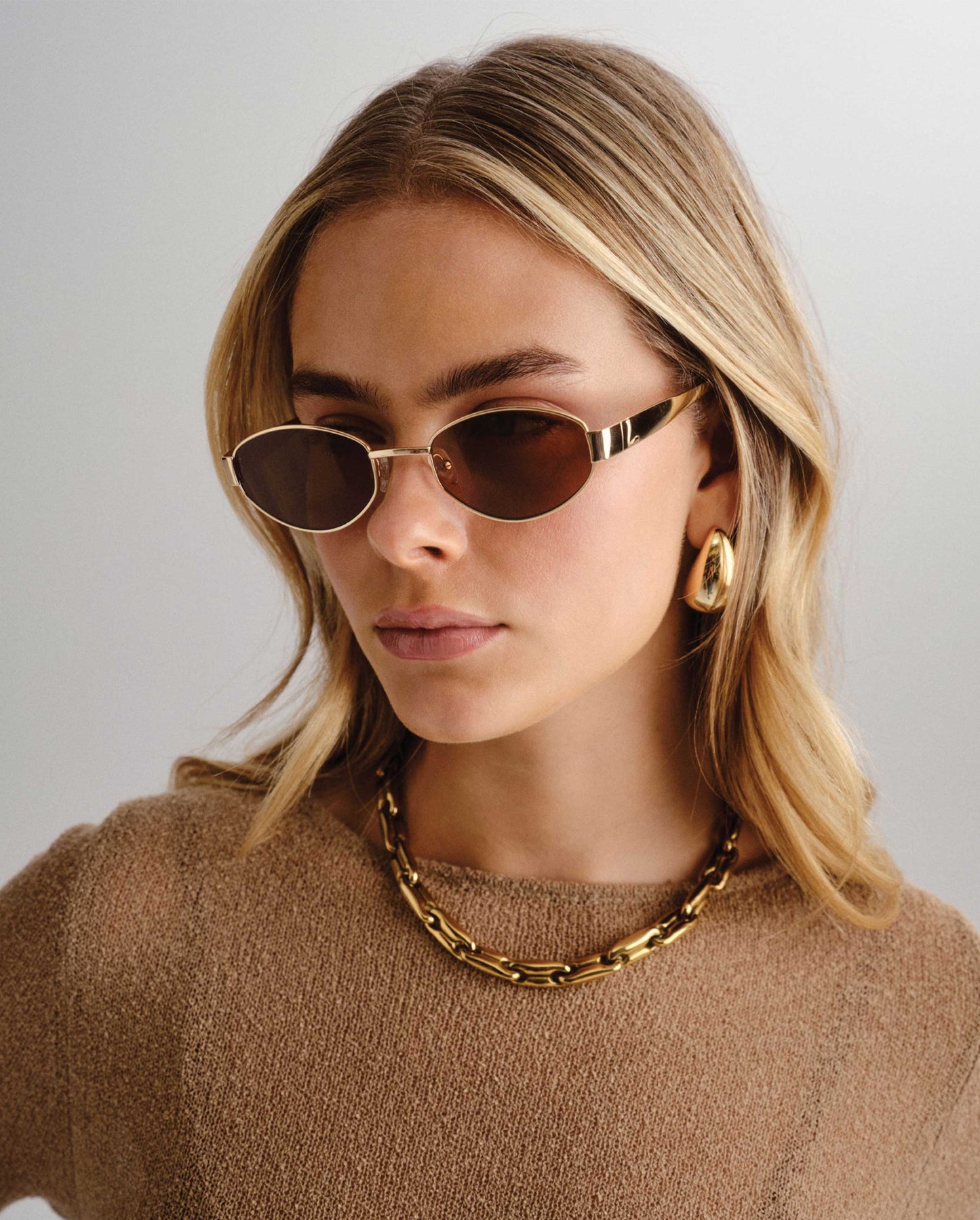 The Boston Gold Female Oval Sunglasses | Luv Lou